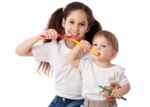 Girl teaches boy brushing teeth