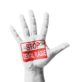 Open hand raised, Stop Dental Plaque sign painted, multi purpose